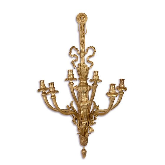 Bronzen wanddecoratie voor zes kaarsen met hierin een klavertje vier